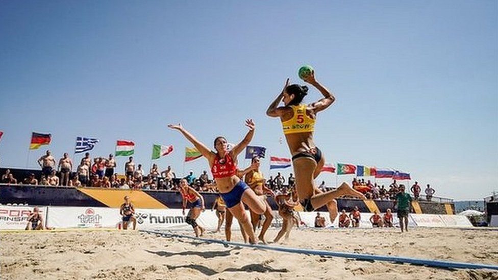 US women's beach volleyball team wears bikini bottoms after