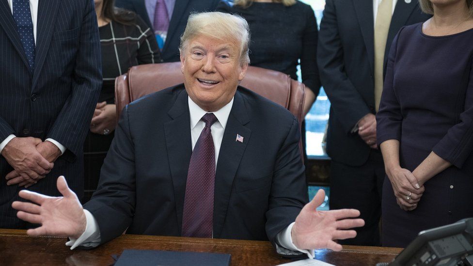 US President Donald J. Trump gestures during the signing of the Cybersecurity and Infrastructure Security Agency Act in the Oval Office of the White House in Washington, DC, USA, 16 November 2018.