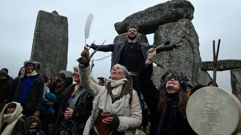 Revellers gather to celebrate the Summer Solstice at Stonehenge ancient stone circle