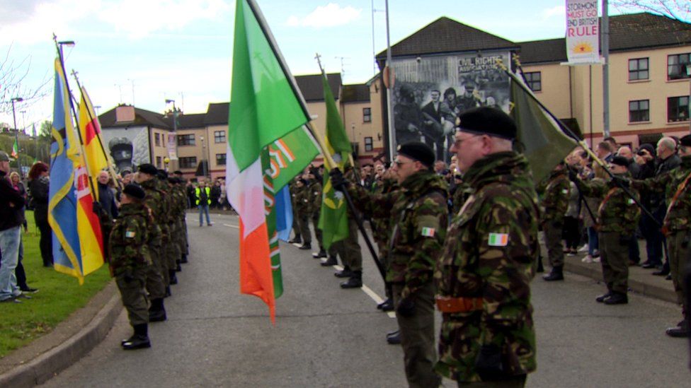 People in paramilitary-style uniforms leading an Easter parade organised by Saoradh in Derry in 2017