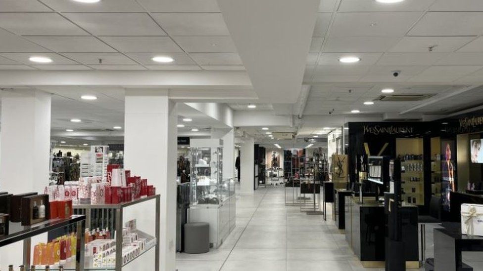 The inside of Bradbeers showing the cosmetic counters with various brands.