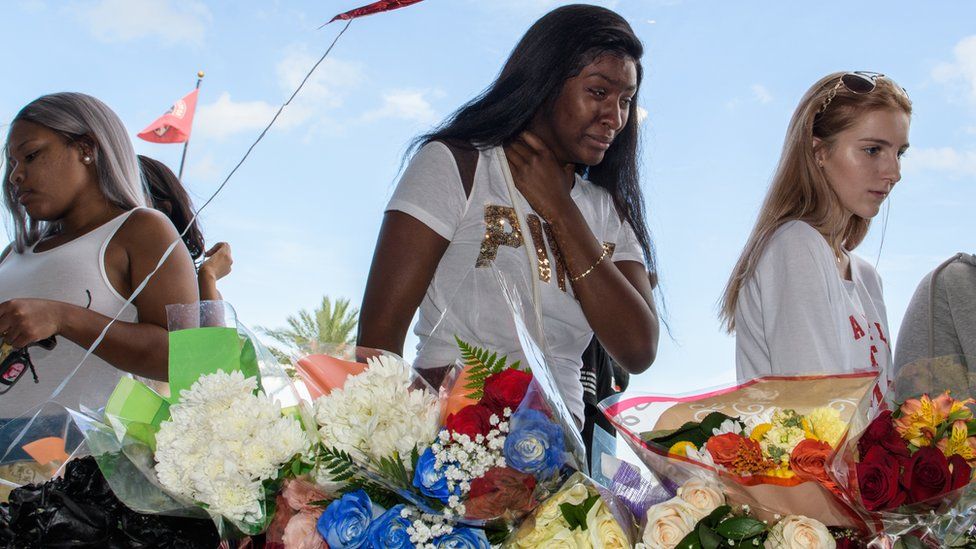Fans mourn the death of musician XXXTentacion at a service in Florida