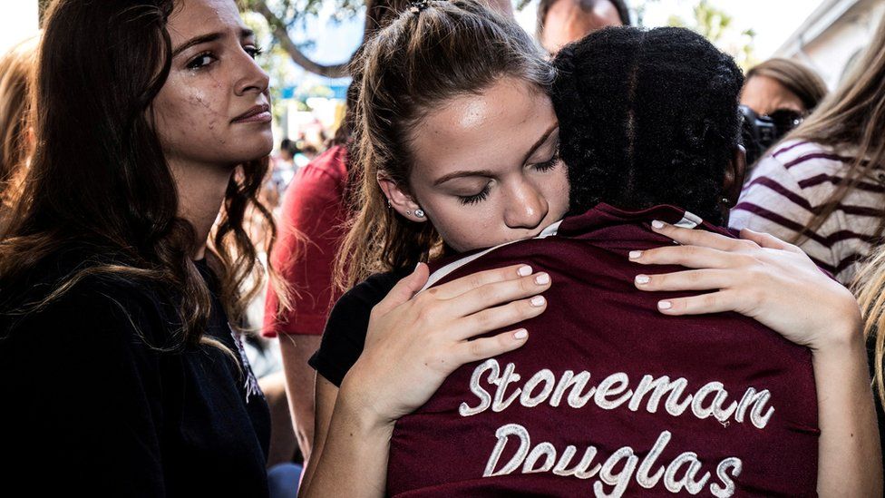 Students from Stoneman Douglas High School attend a memorial following the shooting