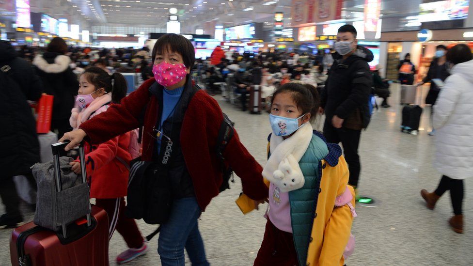 People wearing masks at Hongqiao railway station in Shanghai