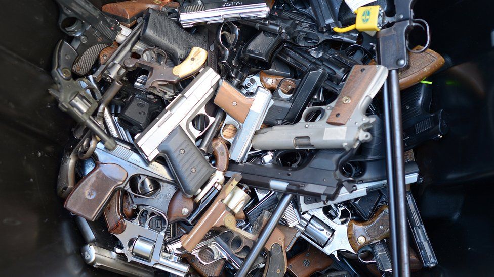 Guns in a pile