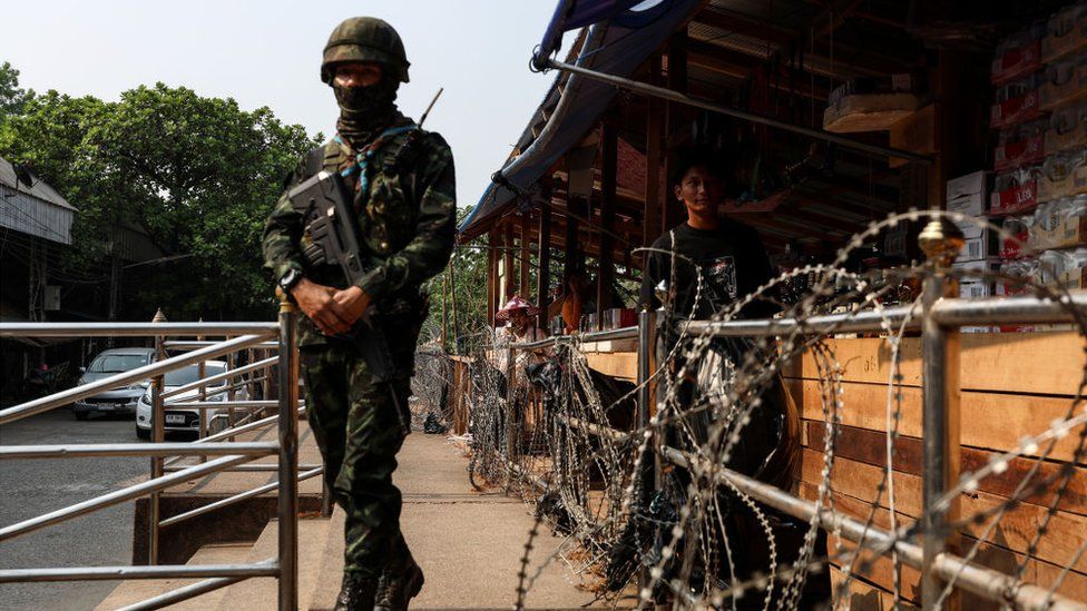 A Thai military personnel stands guard near the Thai-Myanmar border in Mae Sot, Thailand on April 11, 2024. Myanmar ethnic rebels and civilian militia took over from the military forces the town of Myawaddy, a crucial trade hub near the Thai border.