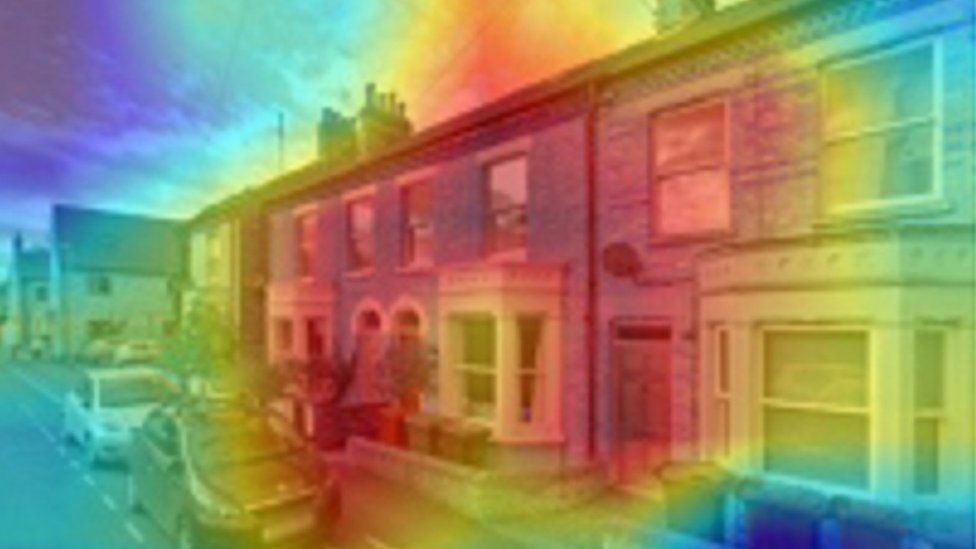 View of terraced houses overlaid by large red blob, with yellow line around the edge showing heat loss.