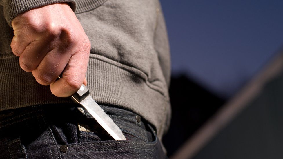 Man with knife in pocket