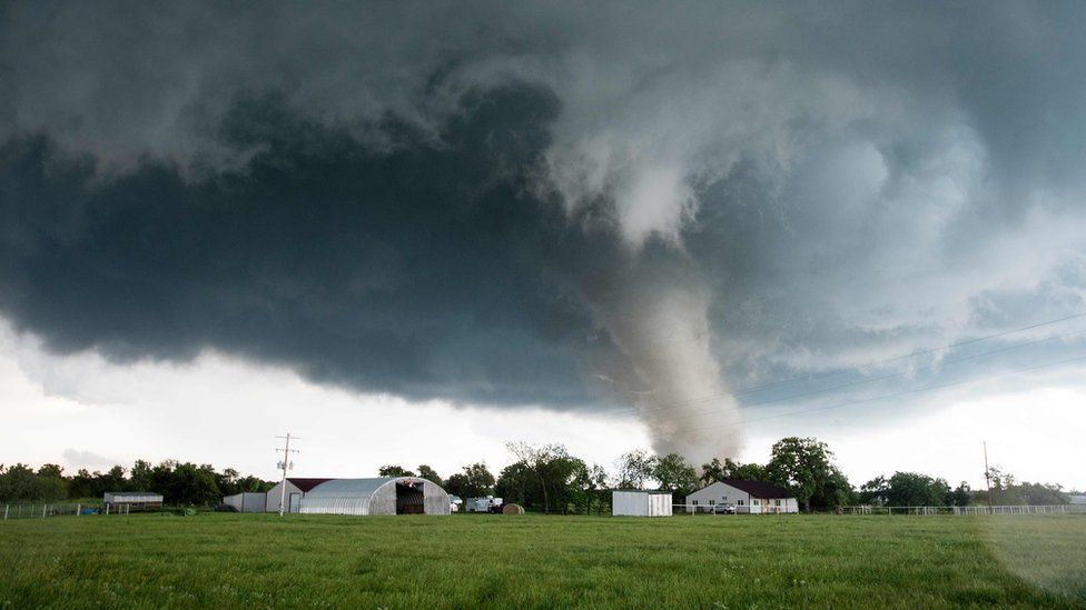 A tornado rips through a residential area after touching down south of Wynnewood, Oklahoma on May 9, 2016