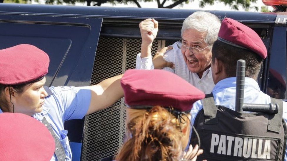 A Nicaraguan man is arrested by riot police during a protest against the government of President Daniel Ortega in Managua on 14 October.