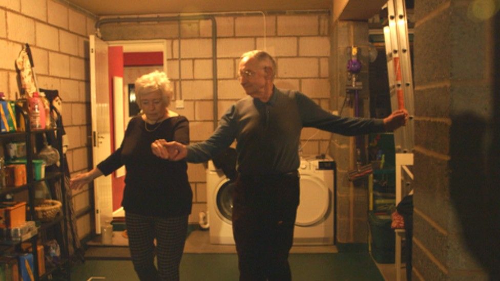 Rosemary and Donald dancing in garage