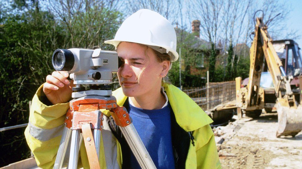 Female civil engineer working on building site