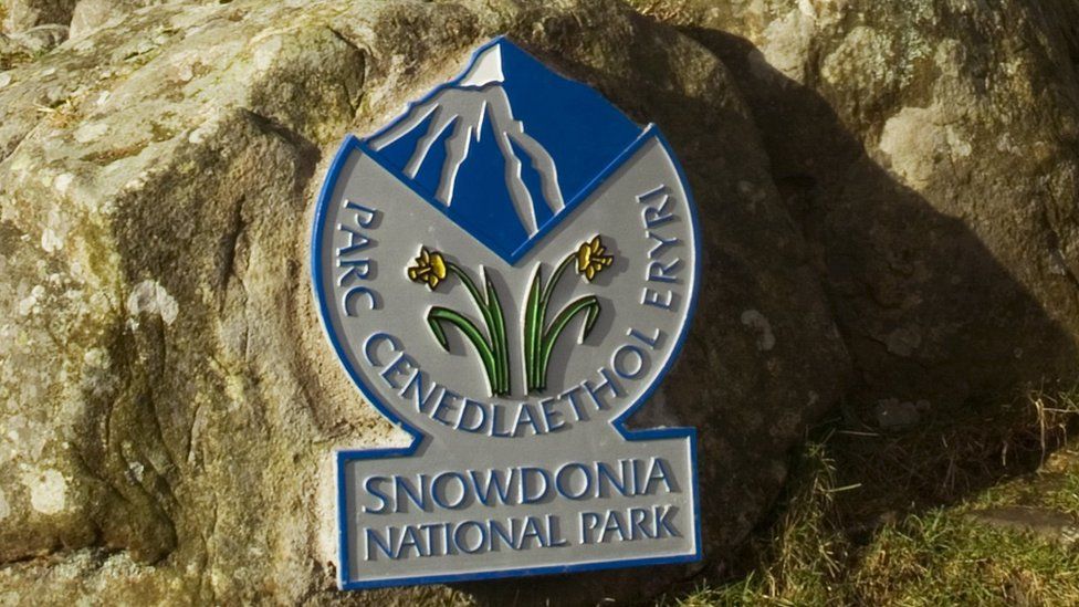 Snowdonia National Park sign on hillside