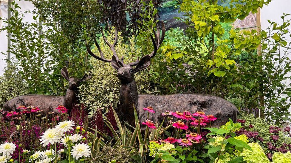 Two stag sculptures at the flower show