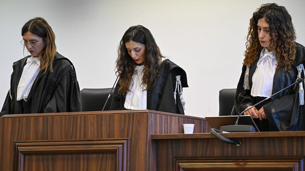 President of the court judge Brigida Cavasino, center, flanked by judges Claudia Caputo, left, and Germana Radice