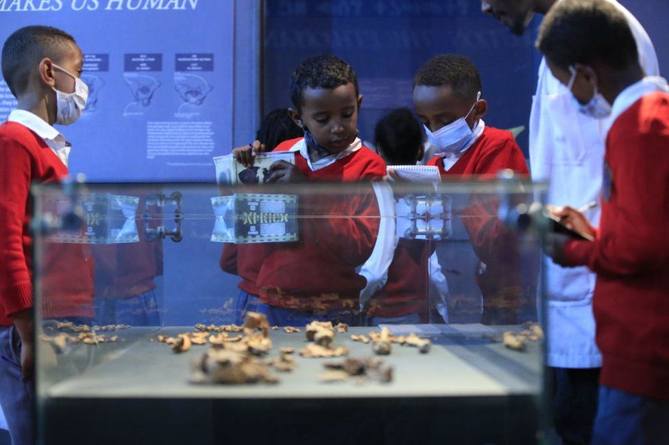 Visitors look at pieces in National Museum of Ethiopia in Addis Ababa, Ethiopia on May 18, 2022. The museum has opened its doors to visitors for free on the International Museum Day