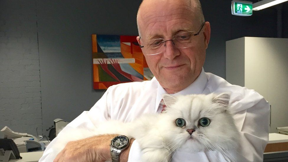 Senator David Leyonhjelm with his white persian cat Oliver.