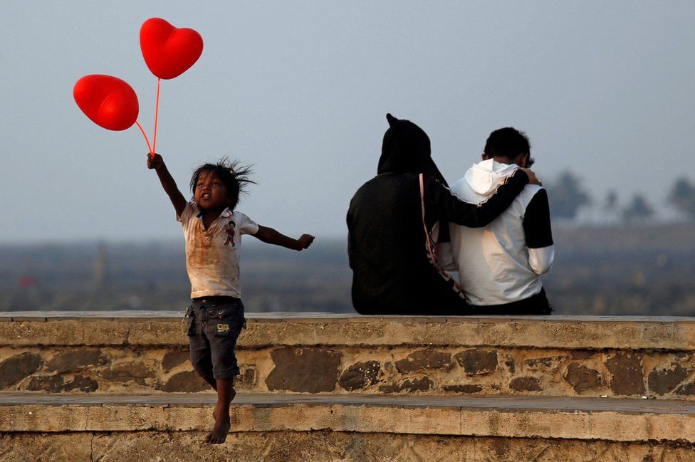 A child jumps from a promenade in Mumbai, India.