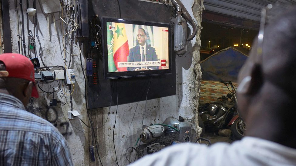 People watching President Macky Sall's presidential address