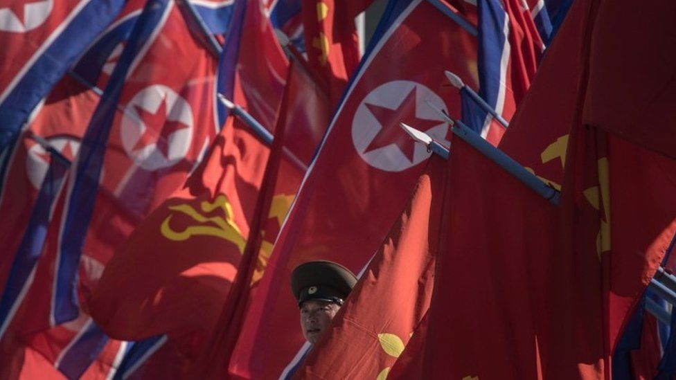 North Korean soldier and flags, file