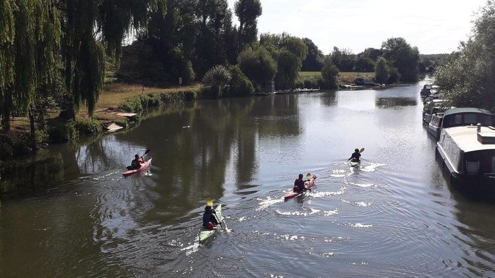 The group kayaking along the Thames