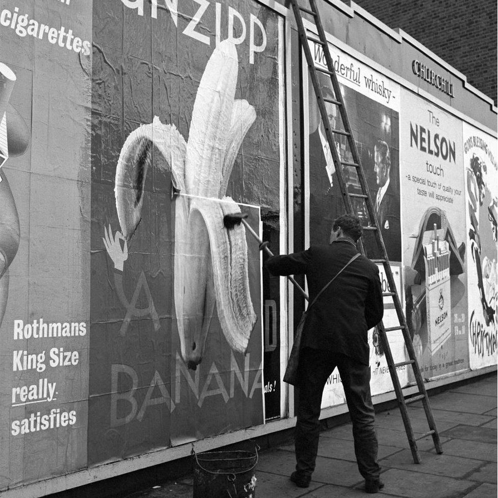 A man fixing billboard poster advertising the "Unzipp Banana" campaign, London, UK, circa 1960. (Photo by Frederick Wilfred/Getty Images)