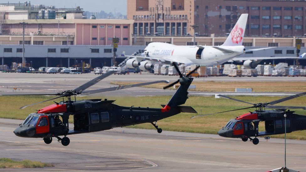 Black Hawk helicopters land at Taoyuan International Airport on 19 July, part of Taiwan's annual war games rehearsal