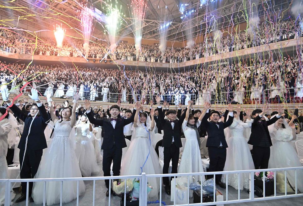 Couples celebrate at a mass wedding ceremony organised by the Unification Church in Gapyeong