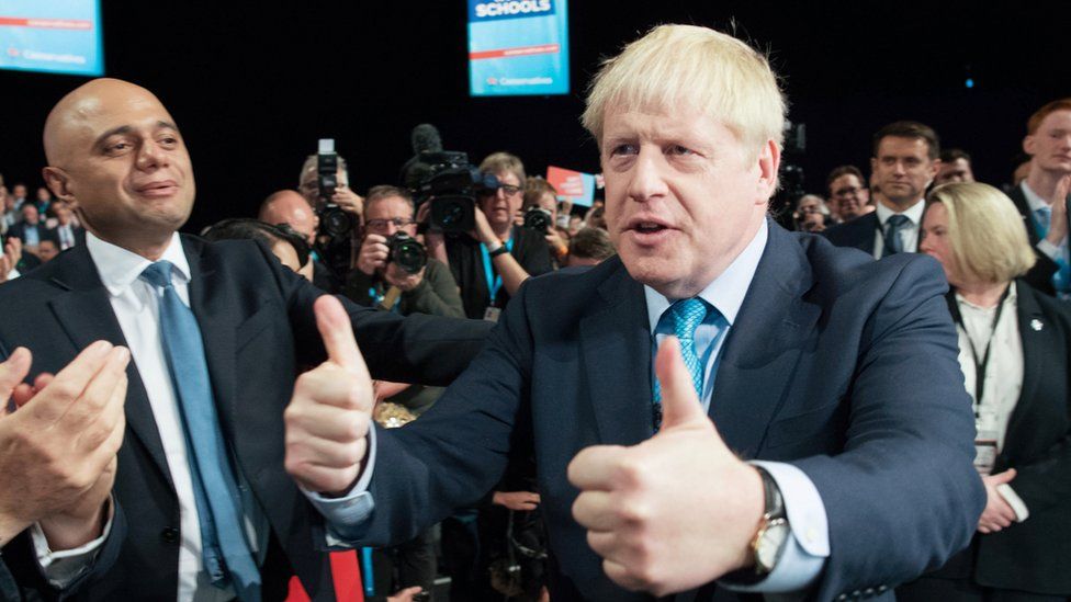 Sajid Javid on the left. Boris Johnson on the right after his speech at the Conservative party conference