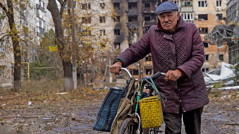 A local resident walks in in front of damaged residential buildings, amid Russia's attack non Ukraine, in the town of Avdiivka, Donetsk region, Ukraine October 17, 2023