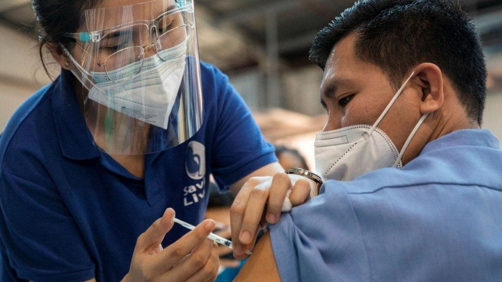 Health worker receives Pfizer booster shot in Quezon City, Philippines - November
