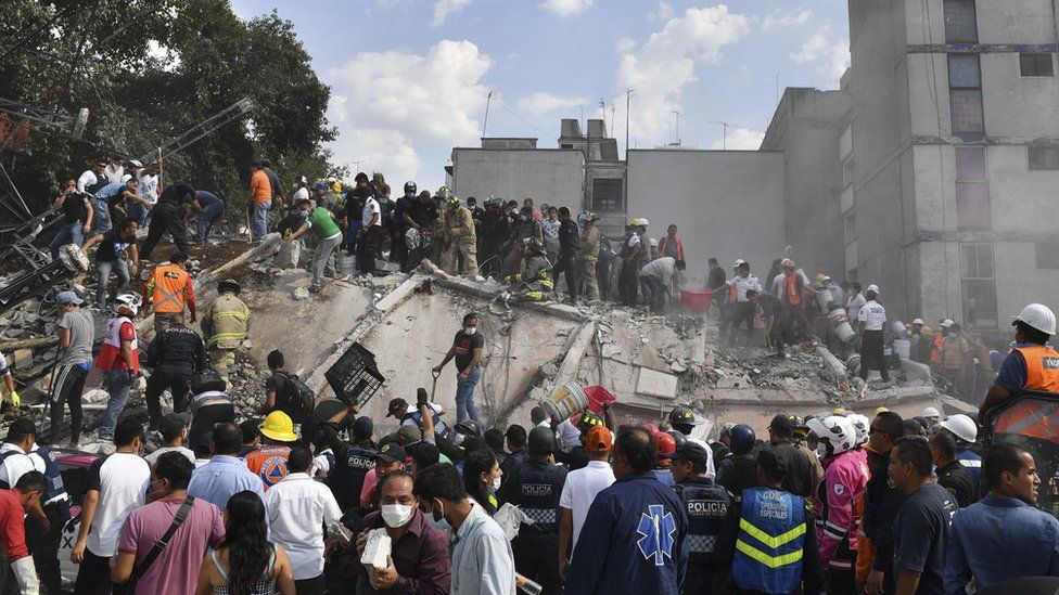 Rescue teams look for people trapped in the rubble after an earthquake in Mexico City