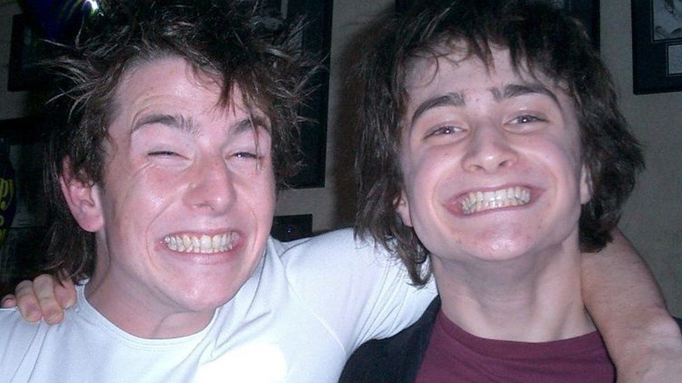 David Holmes and Daniel Radcliffe at a party together