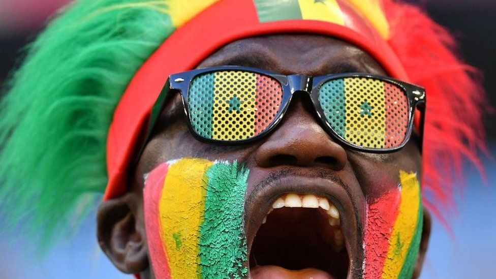 A Senegal fan cheers before the start of the Russia 2018 World Cup Group H football match between Senegal and Colombia at the Samara Arena in Samara on June 28, 2018.