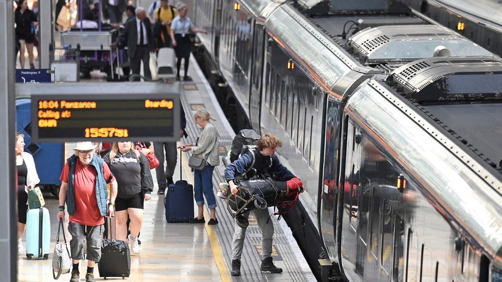 Passengers travel ahead of planned national rail worker strike, in London