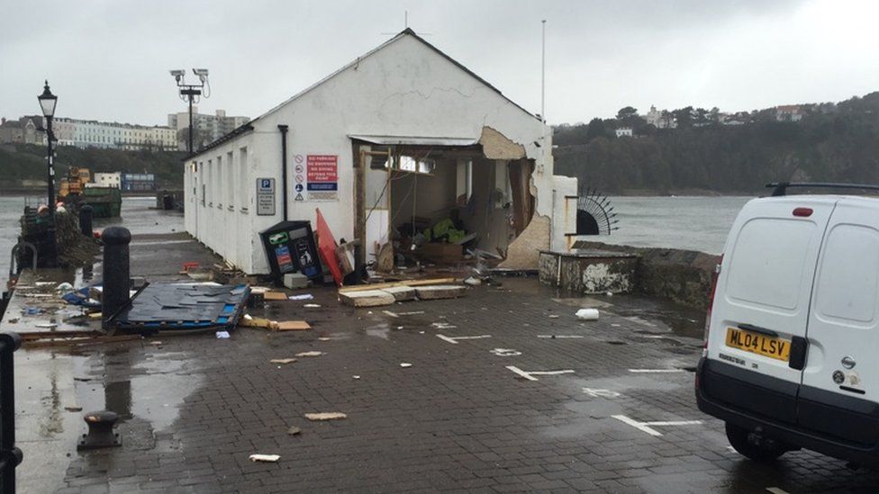 The harbourmaster's office on Tenby harbour has been damaged due to high waves