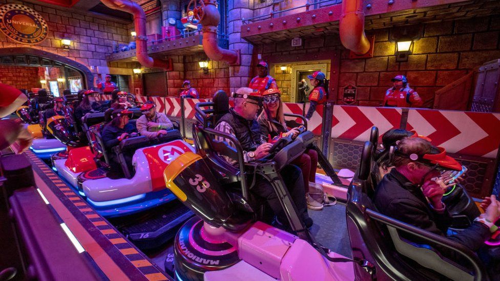 Guests ride Mario Kart: Bowser's Challenge during a media preview of Super Nintendo World theme park at Universal Studios Hollywood in Universal City, California, US