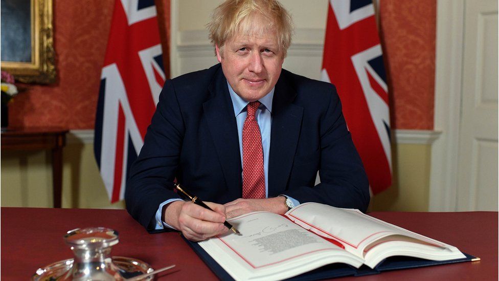 Prime Minister Boris Johnson signing the European Union Withdrawal Agreement