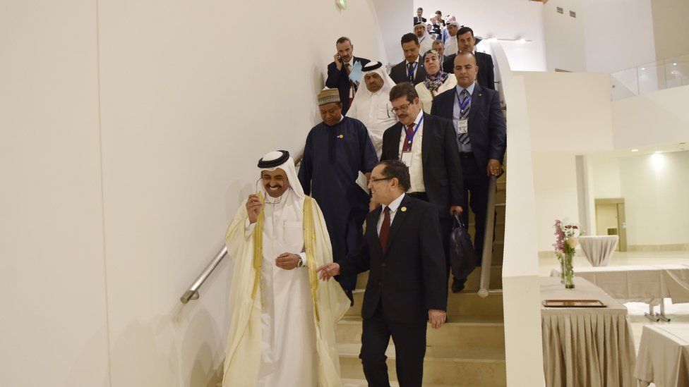 OPEC ministers on way to news conference after meeting in Algiers