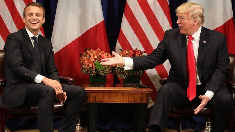 In this file photo taken on September 18, 2017 Franch President Emmanuel Macron (L) laughs with US President Donald Trump before a meeting at the Palace Hotel during the 72nd session of the United Nations General Assembly in New York.