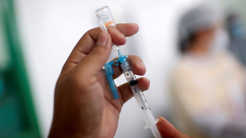 File pic of vaccine going into syringe