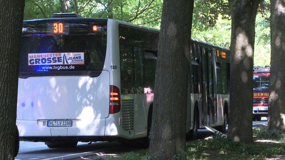 A public service bus stands in Kücknitz near Lübeck, northern Germany, after several people were injured in the bus in an assault by a man wielding a knife on July 20, 2018.