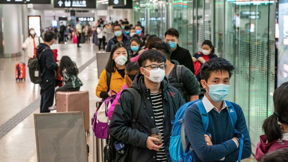 Passengers at a Hong Kong railway station