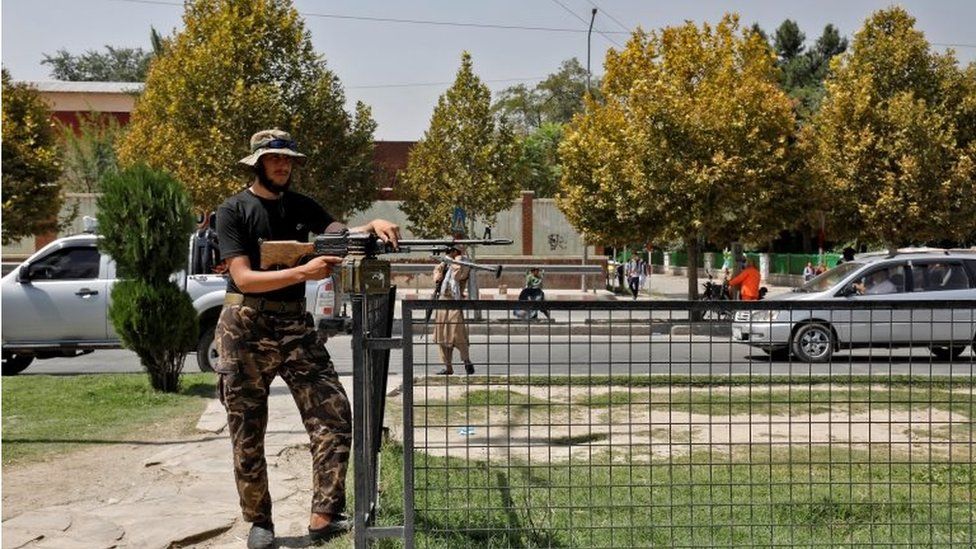 A Taliban fighter stands guard after a blast in front of the Russian embassy in Kabul, Afghanistan, September 5, 2022.