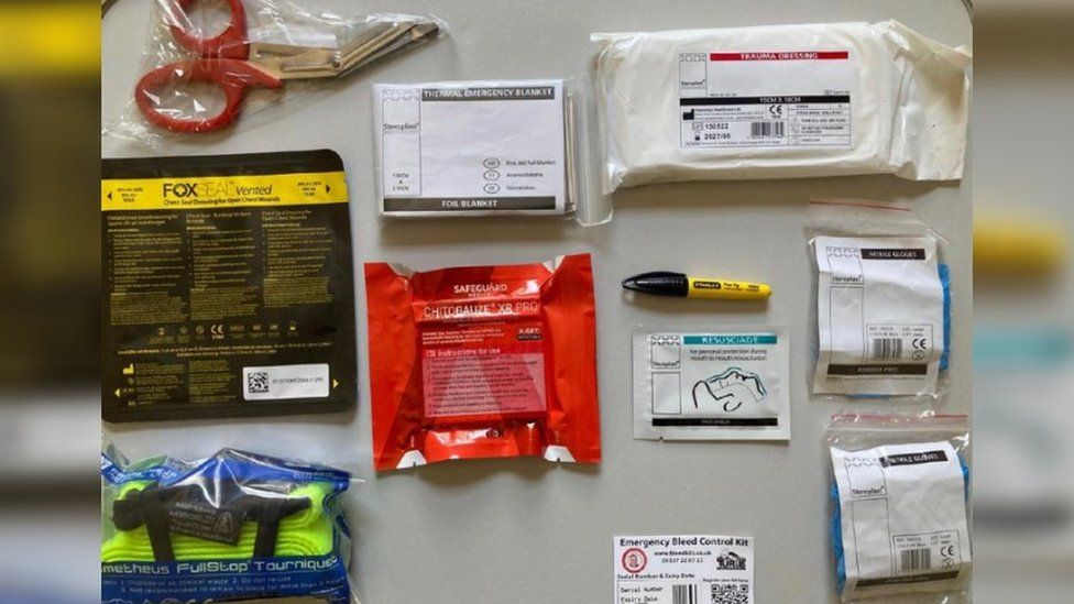 Scissors, gauze, bandages, and other components of the stab kits