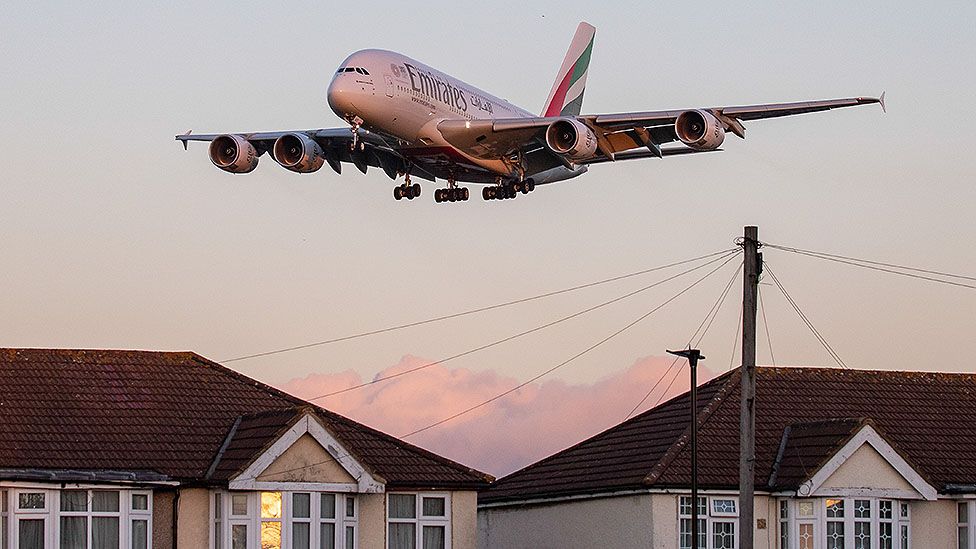 Emirates plane flies over houses near Heathrow
