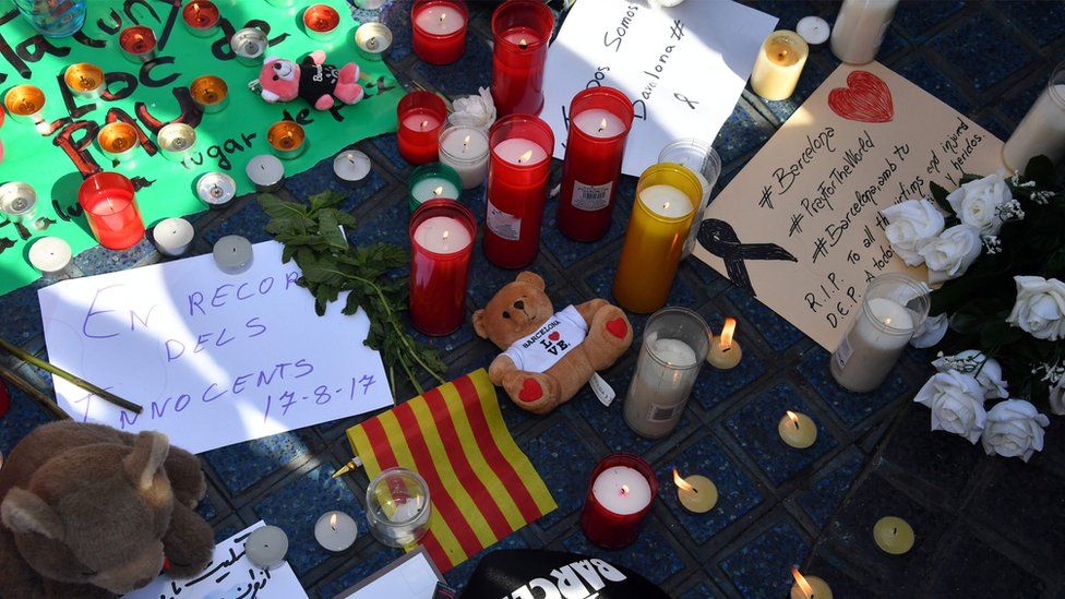 candles and other tributes left at the scene of the van attack in Barcelona