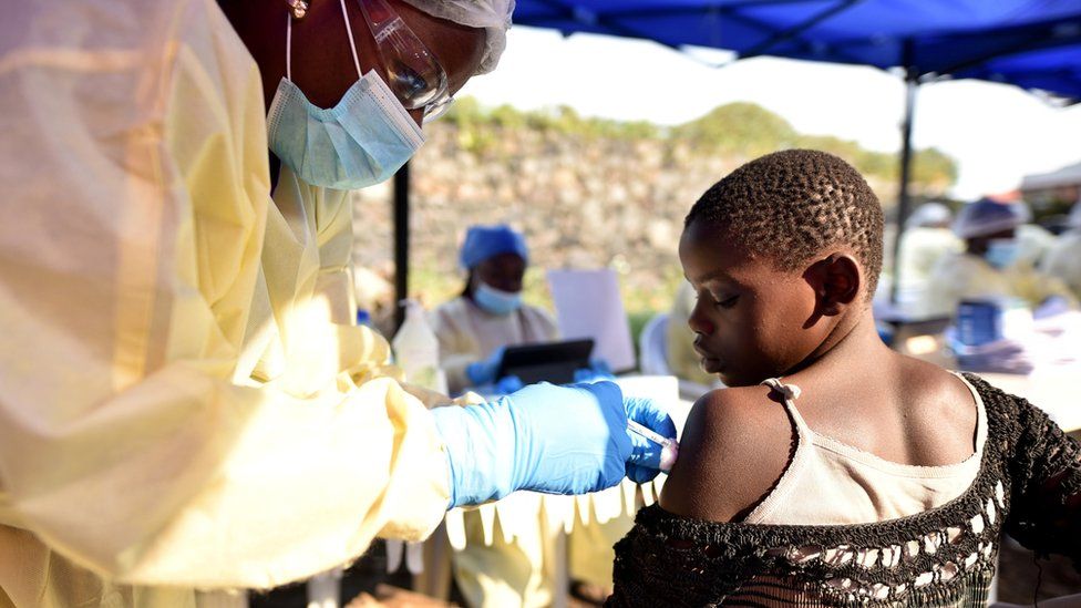 A Congolese health worker administers ebola vaccine to a child at the Himbi Health Centre in Goma