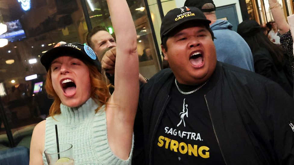 Keri Safran reacts next to union team captain Romel De Silva after the SAG-AFTRA TV/Theatrical Committee approved a tentative agreement with the Alliance of Motion Picture and Television Producers (AMPTP) to bring an end to the 118-day actors strike, at a brewery in Los Angeles, California,. U.S. November 8, 2023