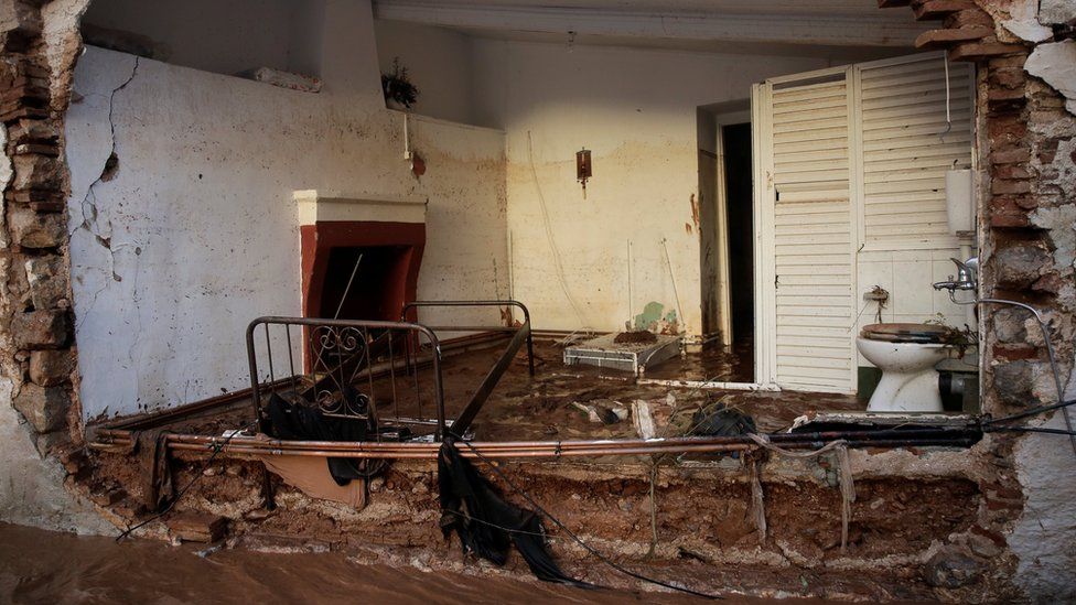 Part of a destroyed house is seen following heavy rainfall in the town of Mandra